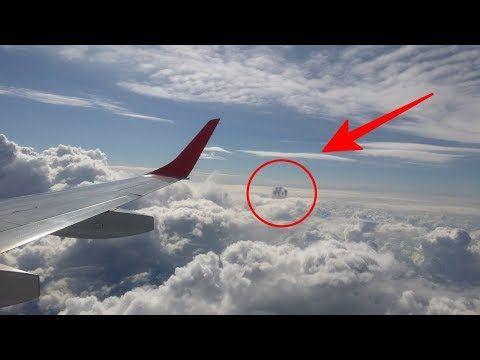 Passengers Aboard Plane Stunned as They Spot Mysterious Object, Suspected to Be a UFO, Amongst the Clouds (VIDEO)